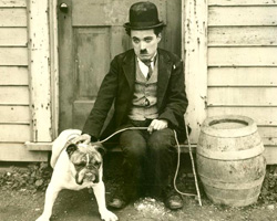 Charlie Chaplin in "The Kid." The film debuted in 1921 and was written and directed by Chaplin.