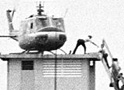 Vietnames refugees climb into a helicopter
